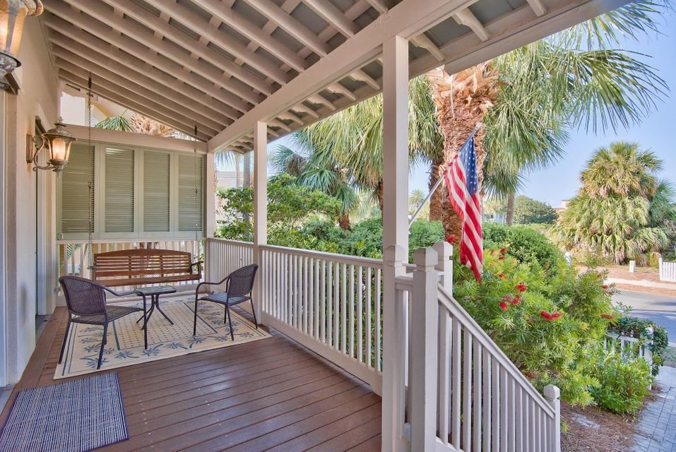 Covered front porch on Destin Pointe home