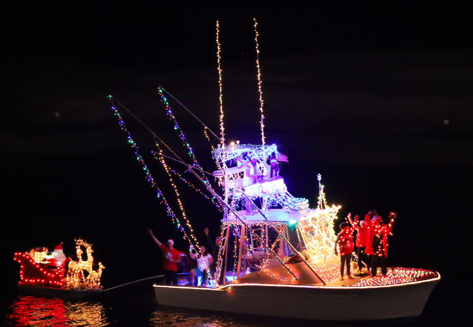Santa's sled being pulled by the Wassiya - private boat in the Destin boat parade